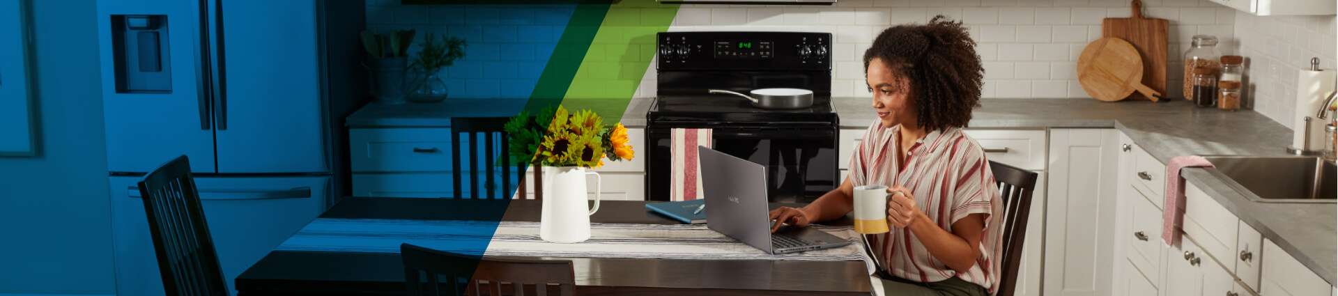 Person using laptop on kitchen table to make payments easily.